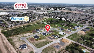 View of property location with nearby suburban area