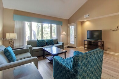 The living room extends to the private back patio.