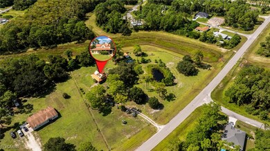 View of property location with a tree filled landscape
