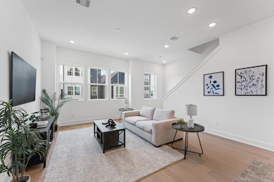 Flooded with natural light, this expansive living
