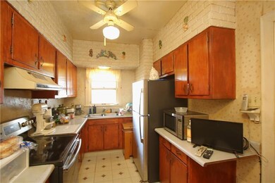 Plenty of Wood Cabinets in 13x9 Eat-in Kitchen