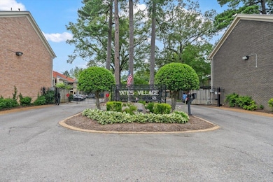 Yates Village featuring a gate and a gated entry