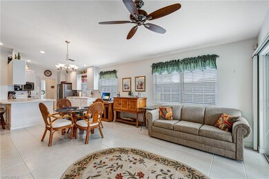 Living area featuring a chandelier, ceiling fan, l