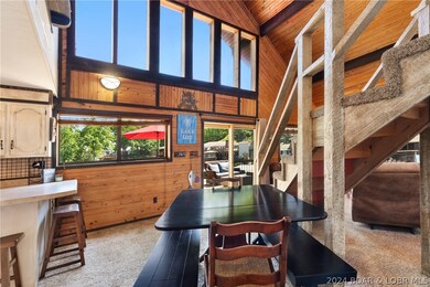 Descend the stairs from upper level to main living