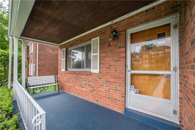 The covered front porch offers a welcoming entry t