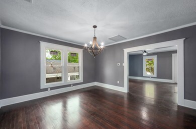Spare room featuring a textured ceiling, visible v