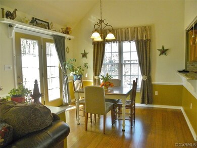 Breakfast nook with bamboo floor, vaulted ceiling,