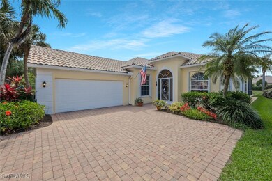 Mediterranean / spanish home featuring stucco siding, decorative driveway, an attached garage, and a tile roof