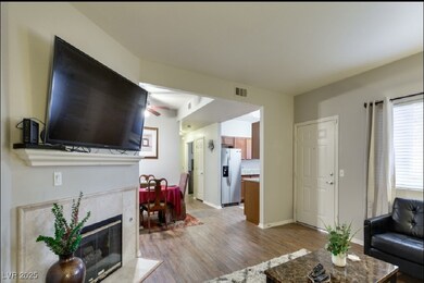 Living area featuring light wood-type flooring, ce