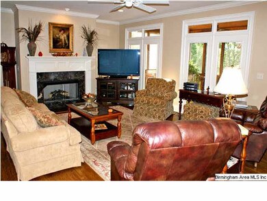 Large Great Room has hardwood floors, crown moldin