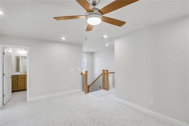 Empty room featuring light carpet, recessed lighting, and a ceiling fan