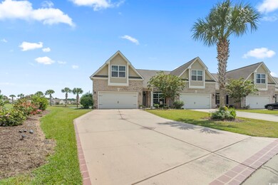 View of front of property with a garage and a fron