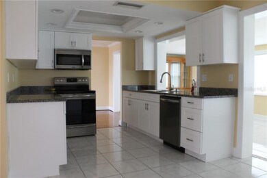 Kitchen with Trimmed Tray Ceiling & Recessed Light