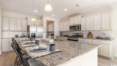 Kitchen with pendant lighting, stainless steel app