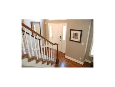 Bright and fresh two story foyer greets your guest