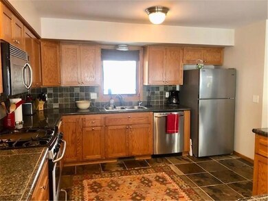 Natural light streams through the kitchen window. 