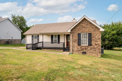 COVERED FRONT PORCH IS WHEELCHAIR ACCESSIBLE.