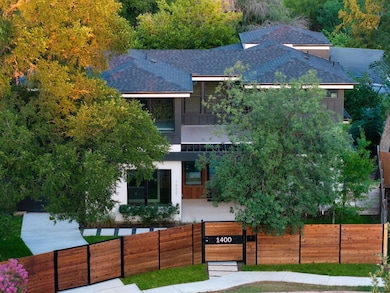 View of front of house featuring a shingled roof 