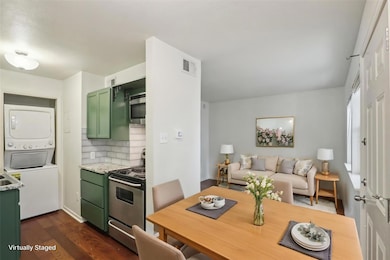 Kitchen with stainless steel appliances, green ca