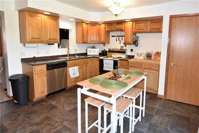 Kitchen with eat in area and patio doors leading o