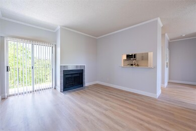 Unfurnished living room featuring crown molding, 