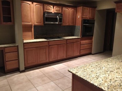 Granite countertops, stainless steel appliances, a