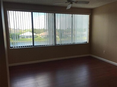 Living room windows for natural light  -  and here's that incredible blue sky & water view again!
