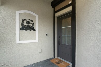 Entrance to property with stucco siding