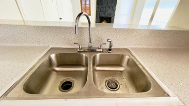 Interior details featuring backsplash, light coun