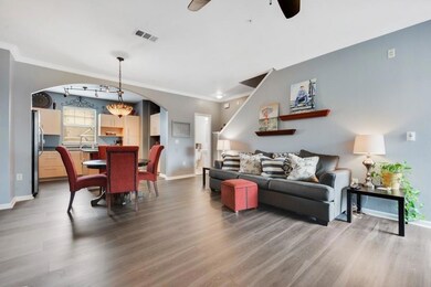Living room with visible vents, baseboards, ceili