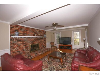 family room with brick fireplace,raised hearth and