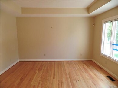 The living room features a tray ceiling and beauti
