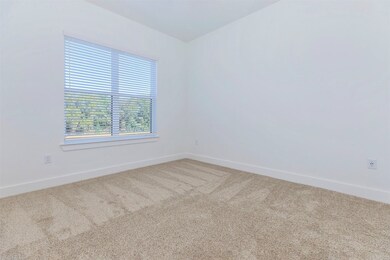 Spacious bedroom with large window