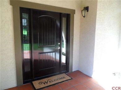 A new entry door and newly installed saltillo tile