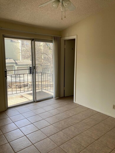 Empty room featuring a textured ceiling, ceiling 