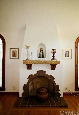 Wood-burning fireplace with alcove. 