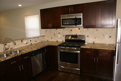 Closer view of the kitchen and appliances.