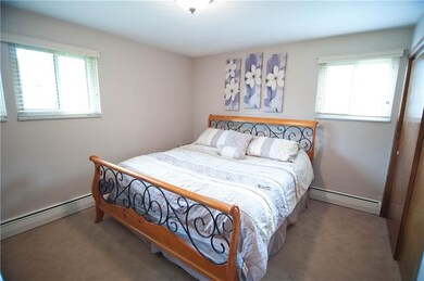 The master bedroom has ample closet space and priv