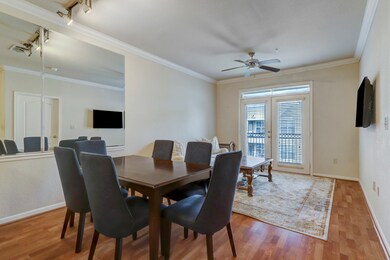 An open living and dining area with laminate floor