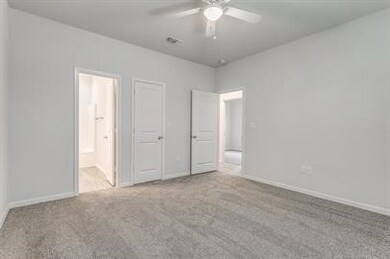 Unfurnished bedroom with carpet flooring, a closet, and ceiling fan