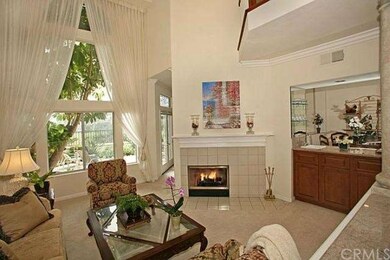 Living Room with Fireplace, High Ceiling and Windo