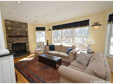 Morning room. Cozy Morning Room with gas stone fireplace and hardwoods.