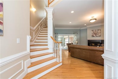 Hardwood floors & detailed moldings welcome you