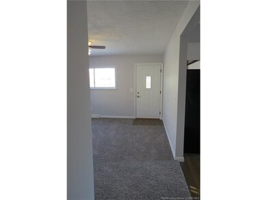 VIEW OF LIVING ROOM FROM HALL WAY...
