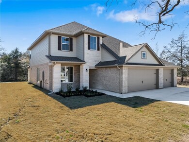 Front of property featuring a garage and a front l