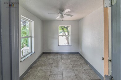 Spare room with a textured ceiling and a ceiling 