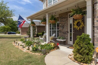 Entrance to property featuring a yard and a porch