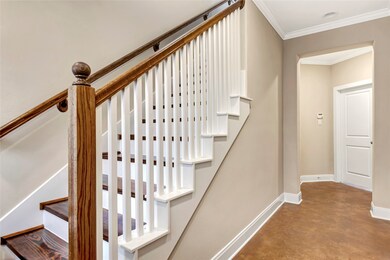 Step into foyer, wood staircase leads to the main
