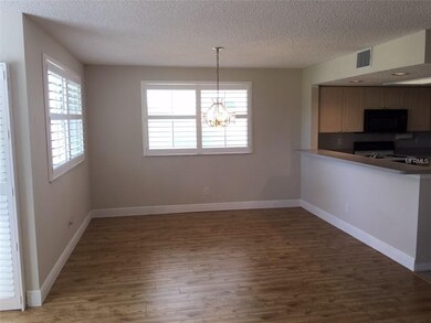 Dining area with breakfast bar to kitchen
