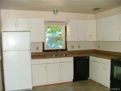 The Kitchen has lots of cabinets, double Stainless